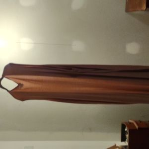 I'm thinking this was a joy it has no sleeves a slit down the side pink in color